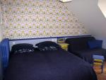Puy de Sancy | Das Schlafzimmer mit einem Doppelbett und Schlafcouch
